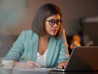 Woman at laptop looking at website